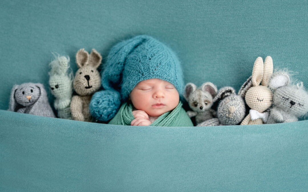 Beautiful,Newborn,Sleeping,With,Knitted,Toys